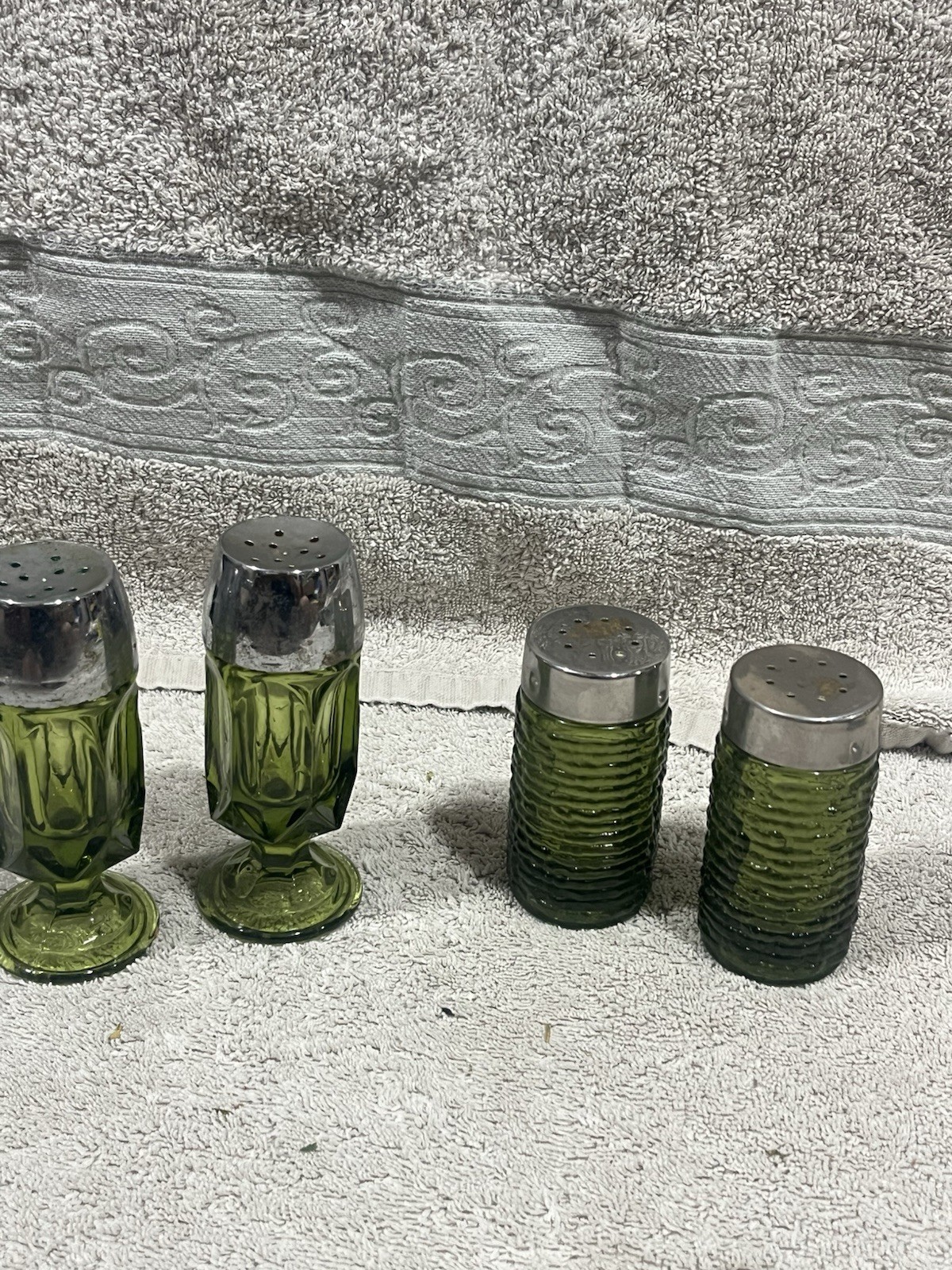 Lot of 4 vintage mid-century modern avocado green glass salt & pepper shakers.