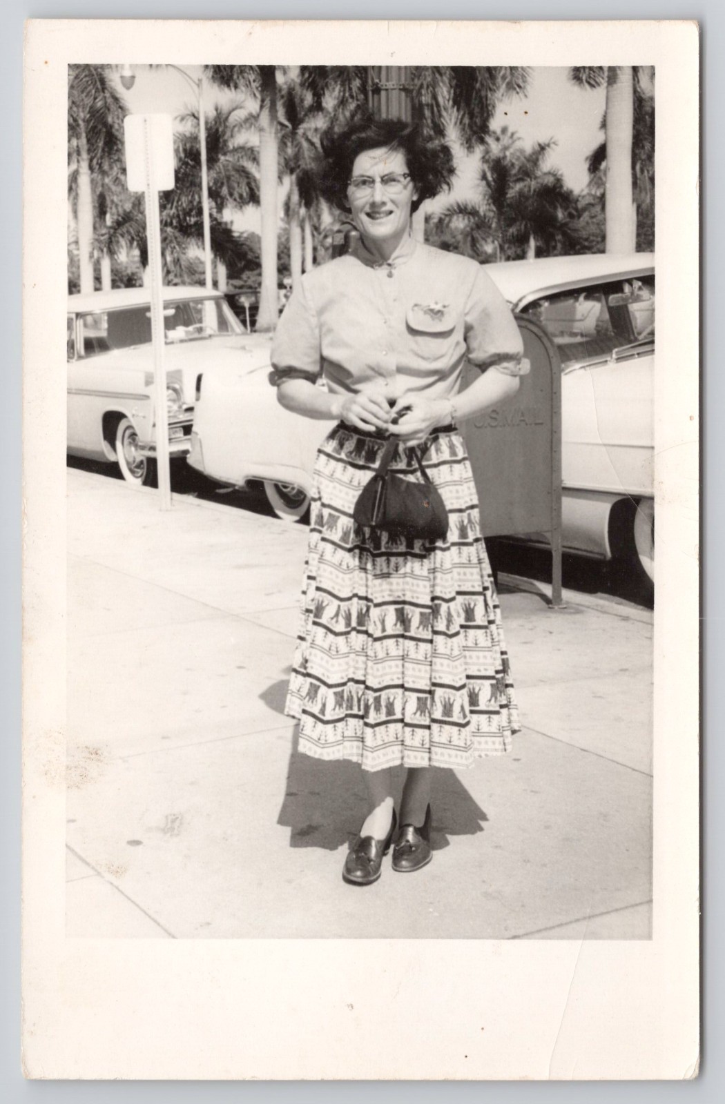 RPPC c1950s Woman in Long Skirt Automobiles Cars in Background Postcard