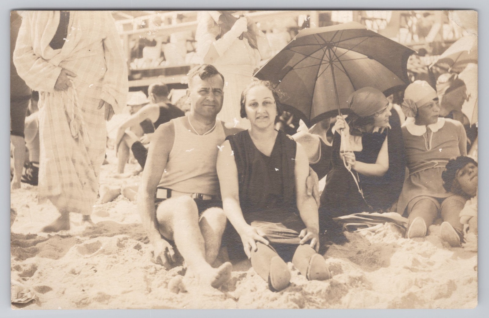 RPPC Beach Scene Couple in Bathing Suits Candid Smile Umbrella Boardwalk 1921