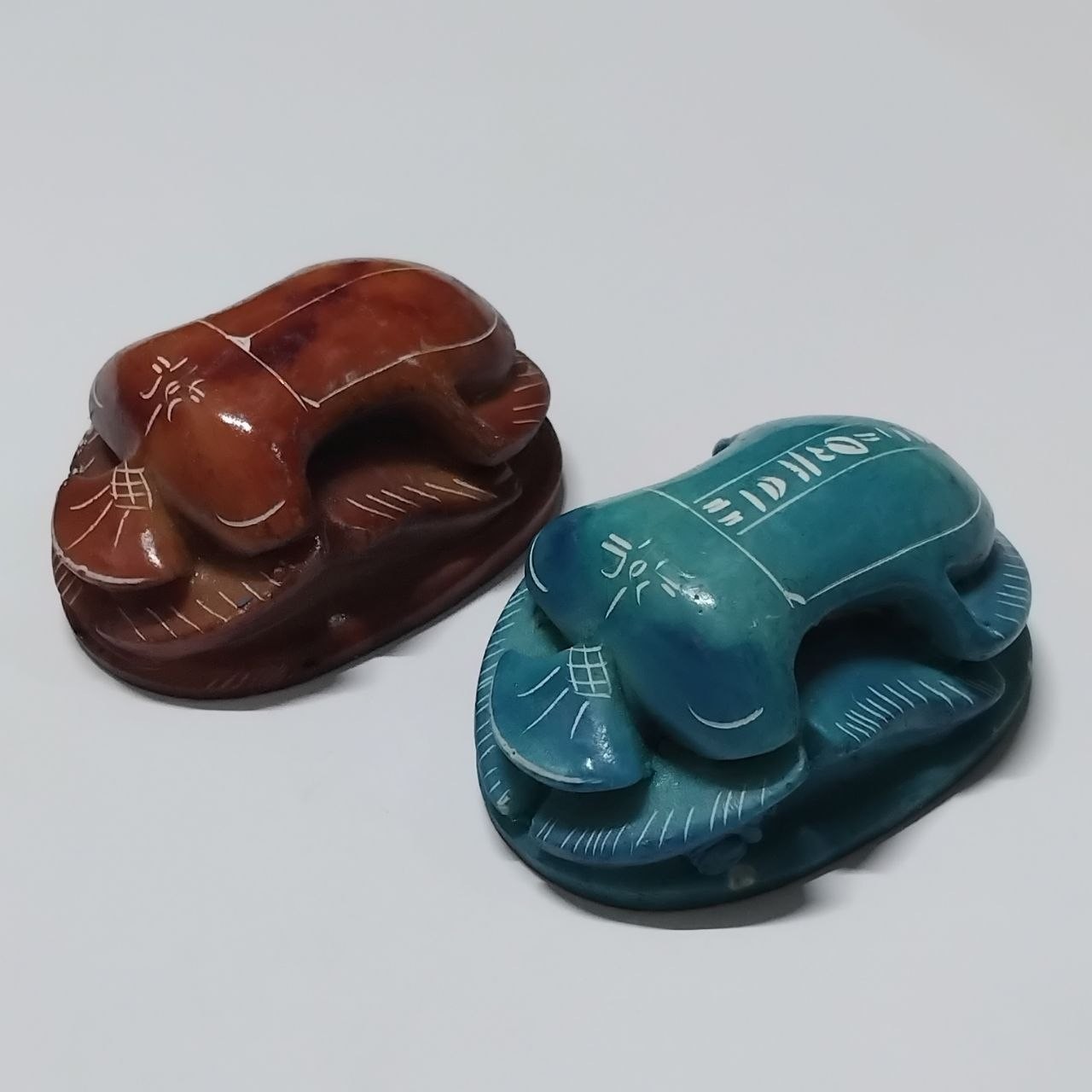 Handcrafted scarab beetle carvings blue and brown stone ancient Egyptian style