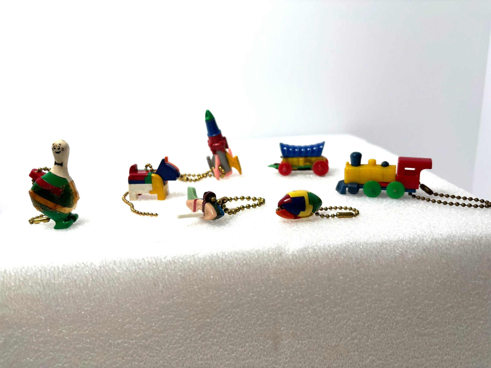 Vintage 1950-1960's Gumball Toy Puzzle Key Chains Lot of 7 including Rocket Ship