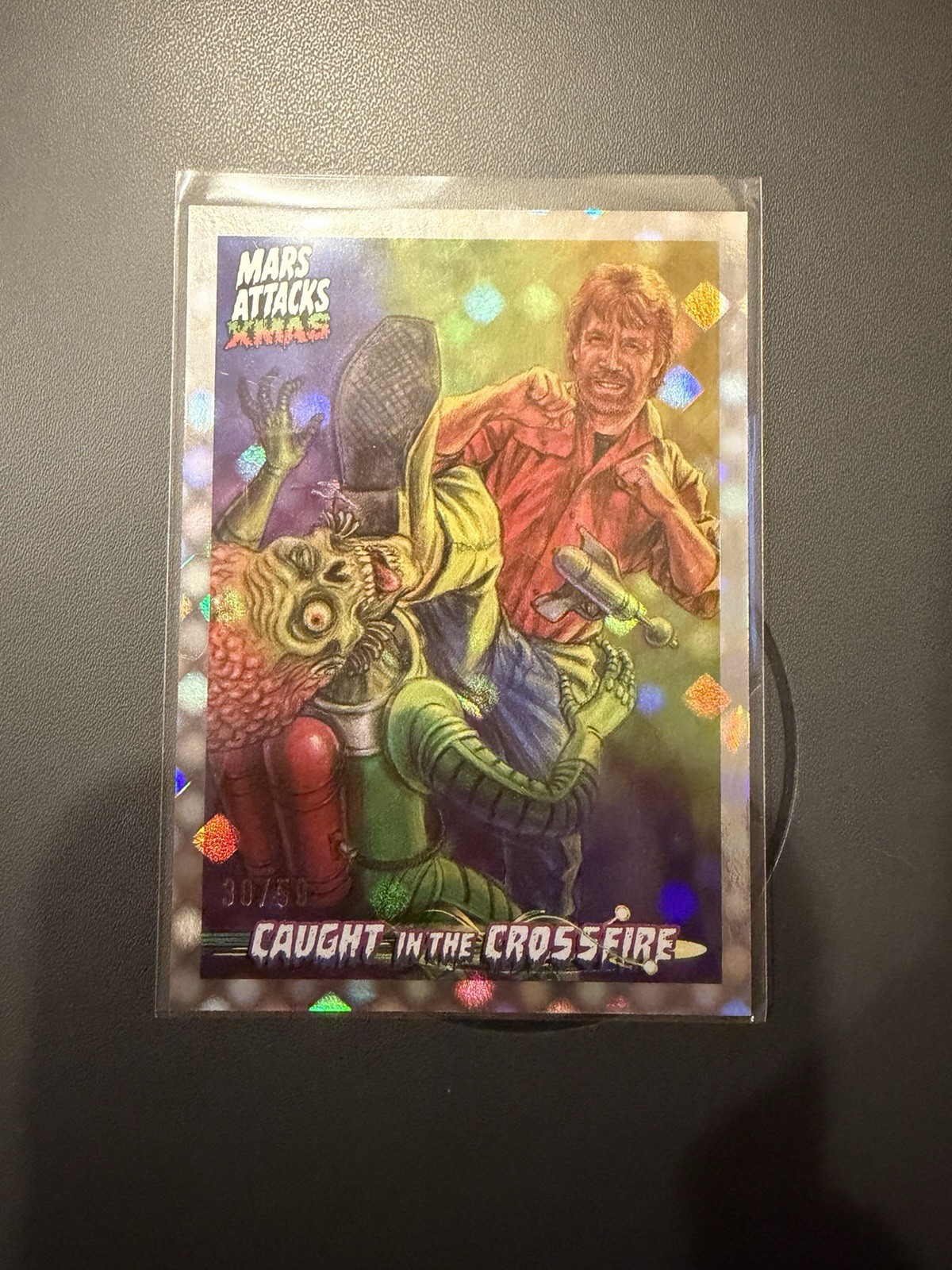 2026 Topps Mars Attacks XMAS Chuck Norris Caught in the Crossfire Dotz /50 CC-CN