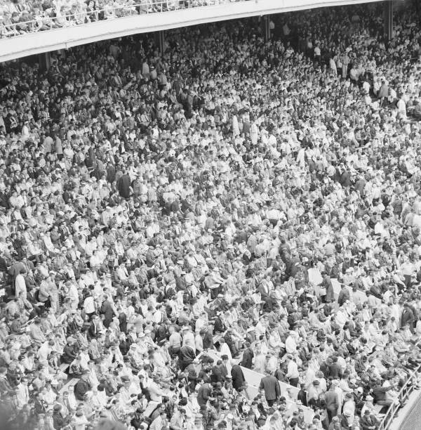 1960s Crowd of sports fans in stadium overhead view Historic Old Photo