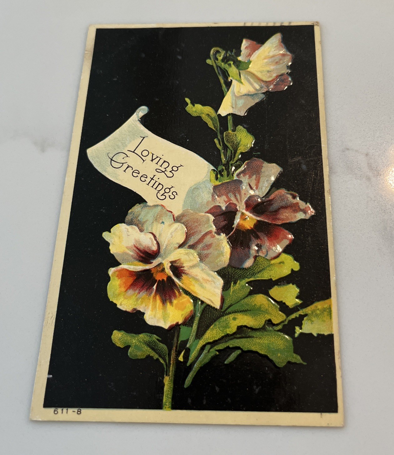 Antique 1910s Loving Greetings Postcard Embossed Pansies Floral Black Background
