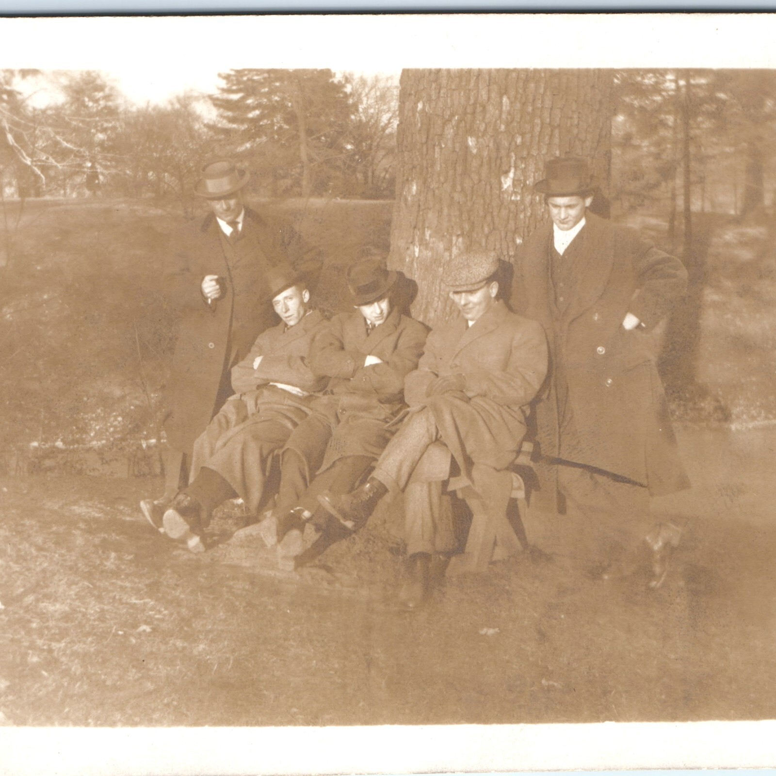 1914 Five Men Group RPPC Postcard Trenchcoats Overcoats Bowler Hats Bench Park