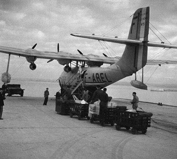 Personnel loading parcels luggage into hold of an aircraft Marigna- Old Photo 2