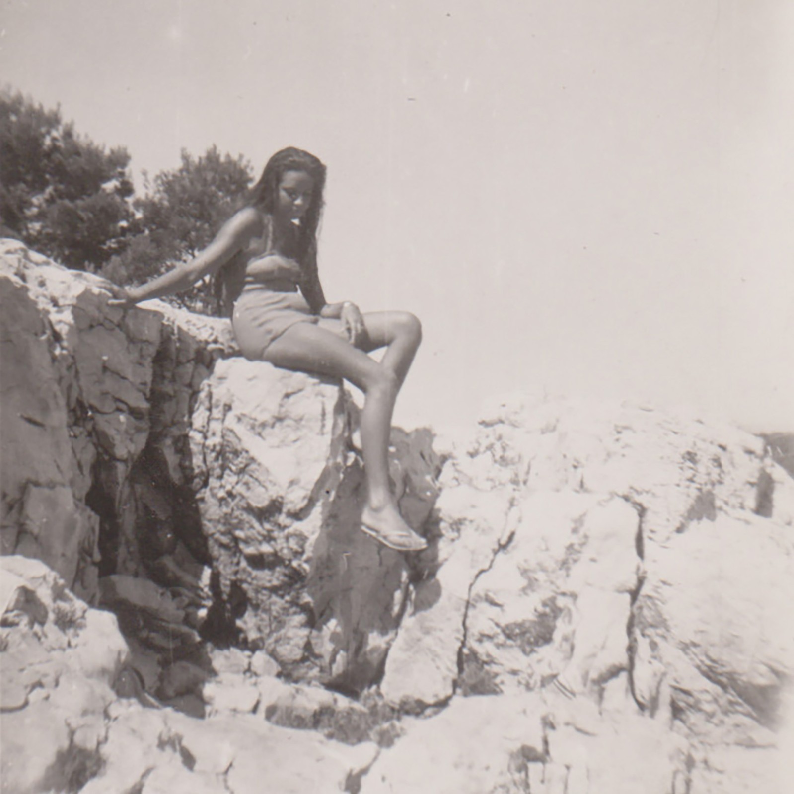Young Bikini Woman Sitting High On Bright Sunlit Seaside Rocks Vintage Photo