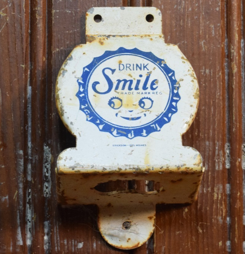 SMILE ORANGE SODA STAMPED PAINTED METAL BOTTLE OPENER SIGN VINTAGE 1950s SUN CAP