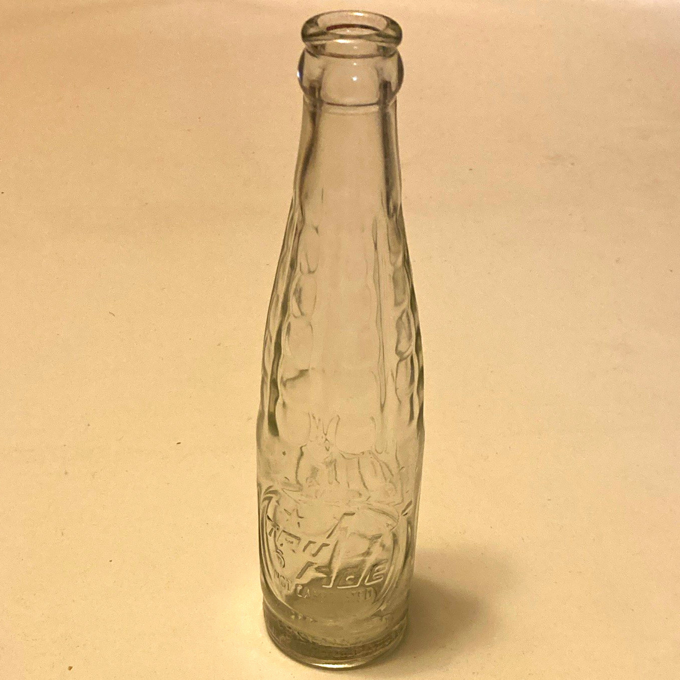 Vintage Tru Ade embossed glass bottle typically from the mid twentieth century 