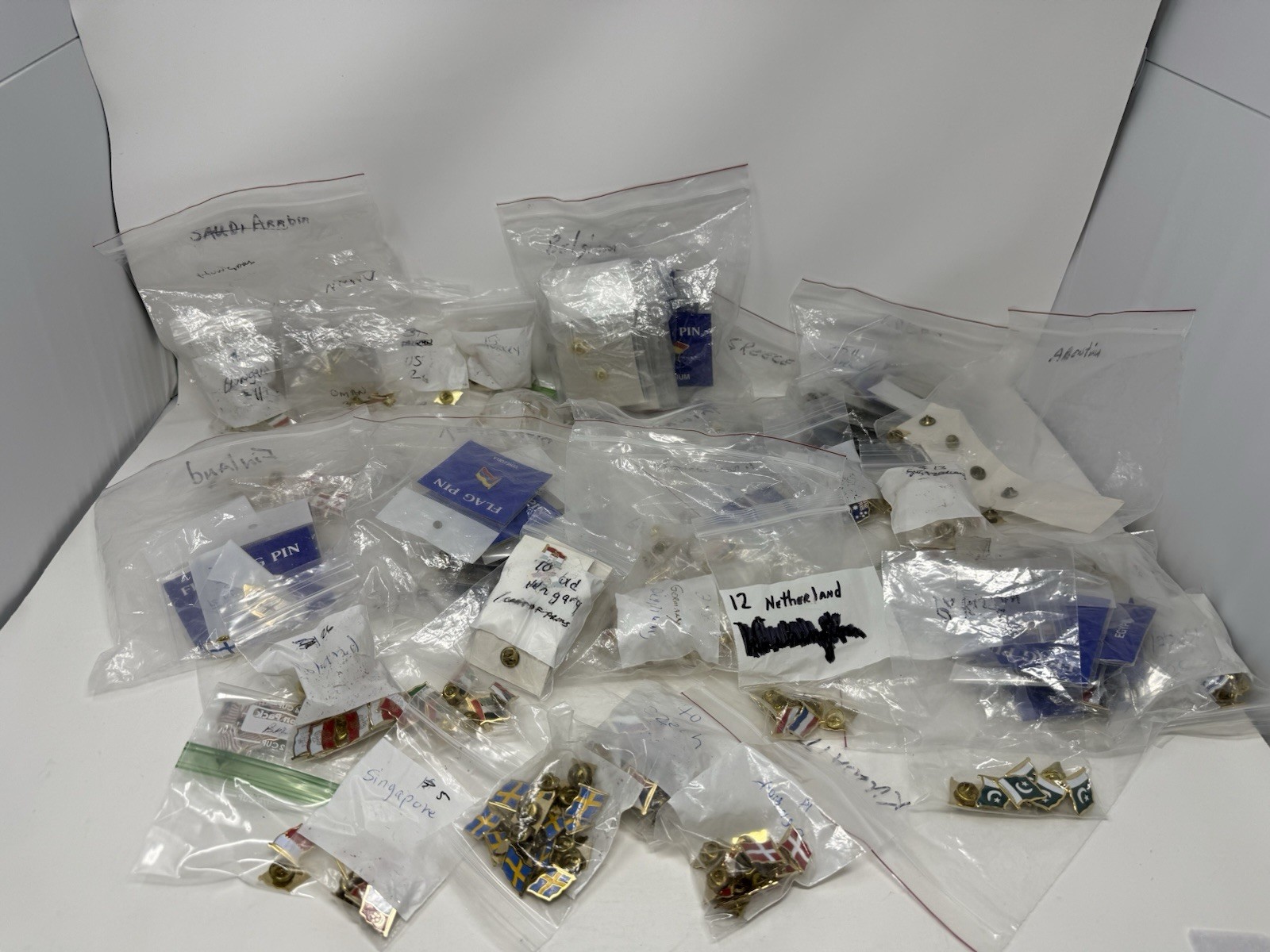 Lot of 477 Country Flag Lapel Pins – 31 Countries – New Enamel Metal Pins Bulk