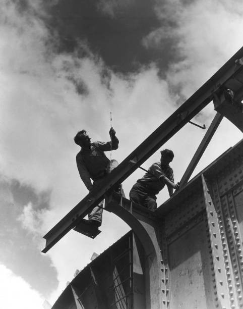 Construction workers on the steel frame of a building circa 1940 Old Photo