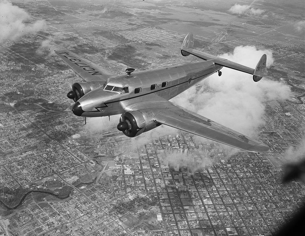 LOCKHEED ELECTRA 12A  Junior in Flight over Houston 8.5 X 11 PHOTO