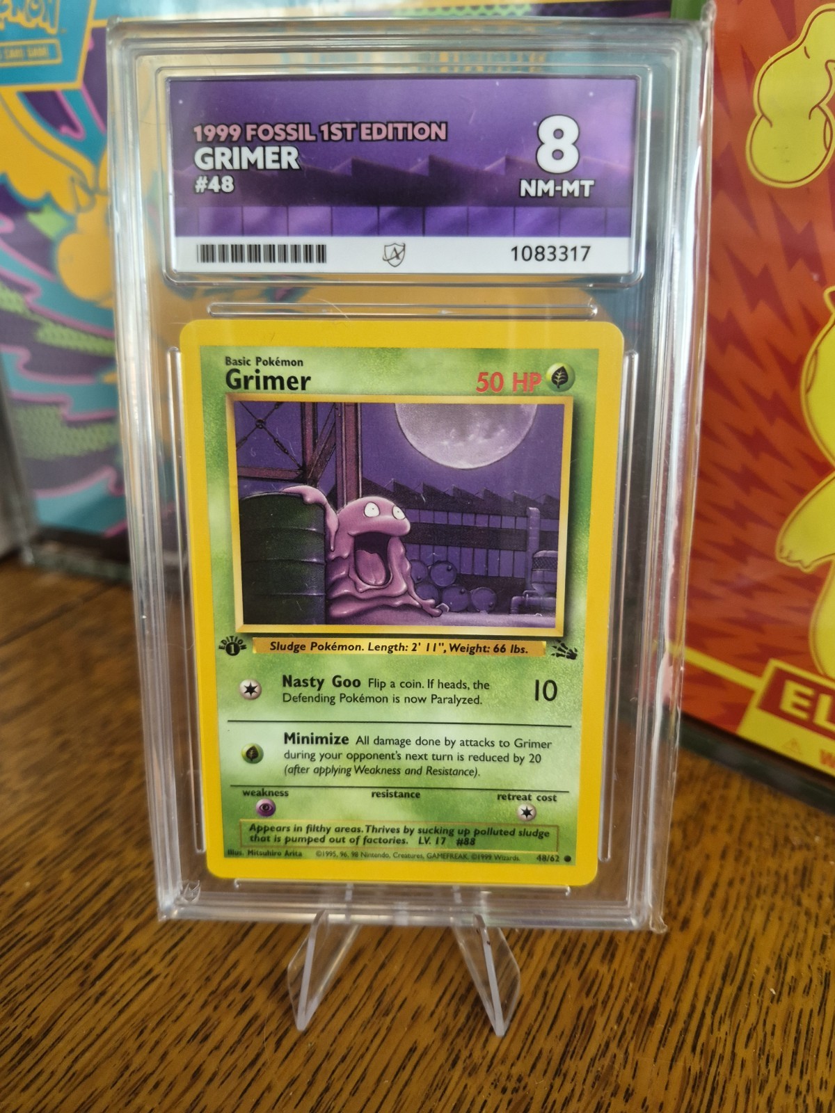 vintage 1999 Pokémon Fossil 1st Edition Grimer card (#48/62) POP 6 Ace Grade 8