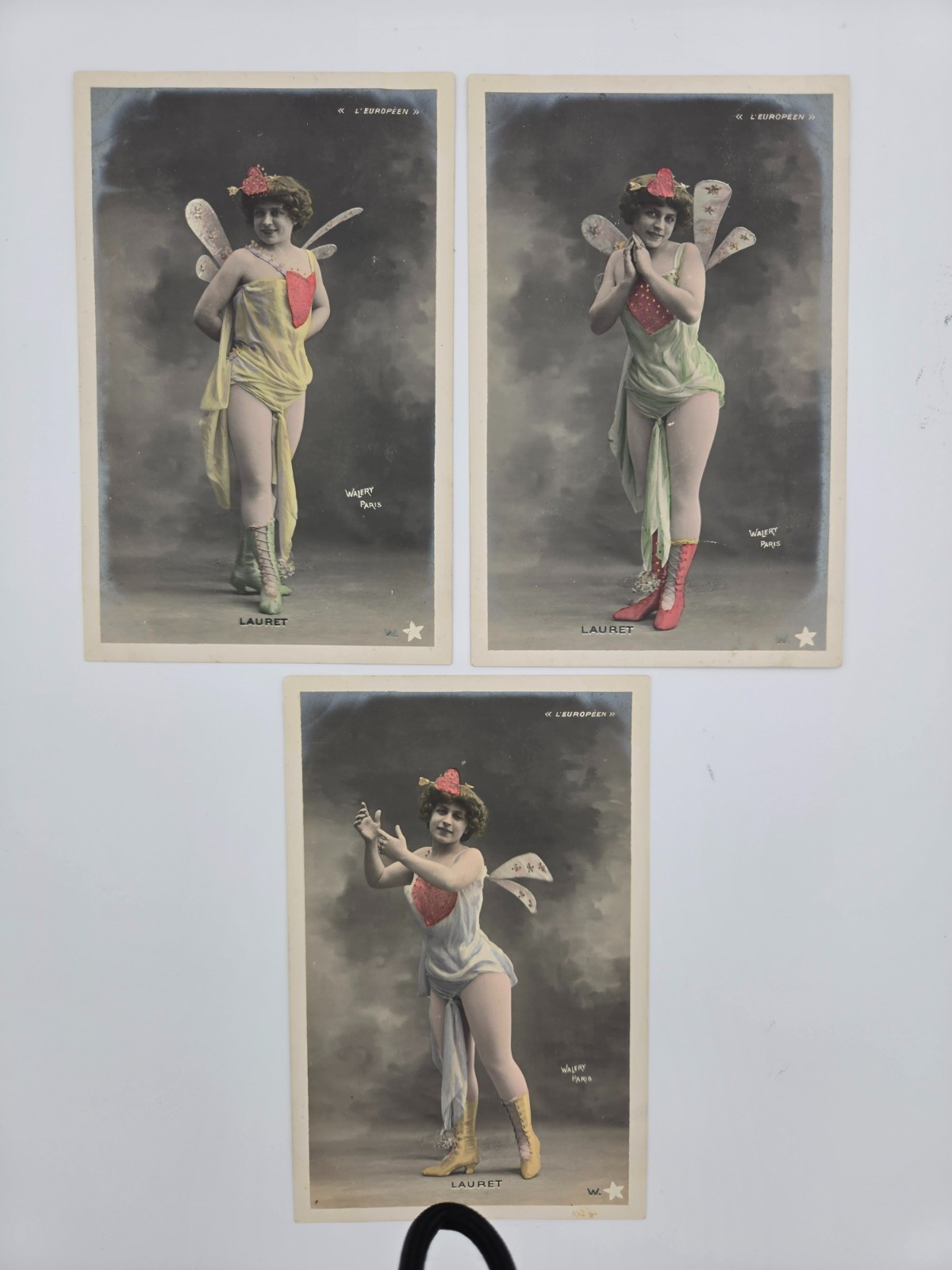 Three elegant antique postcards featuring a charming lady (1890–1930).Original