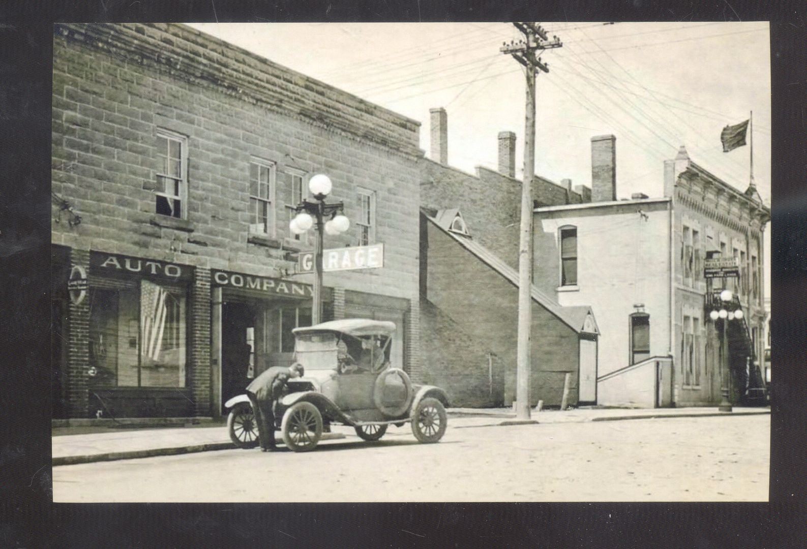 REAL PHOTO IOWA FALLS IOWA STREET SCENE AUTO CAR GARAGE POSTCARD COPY