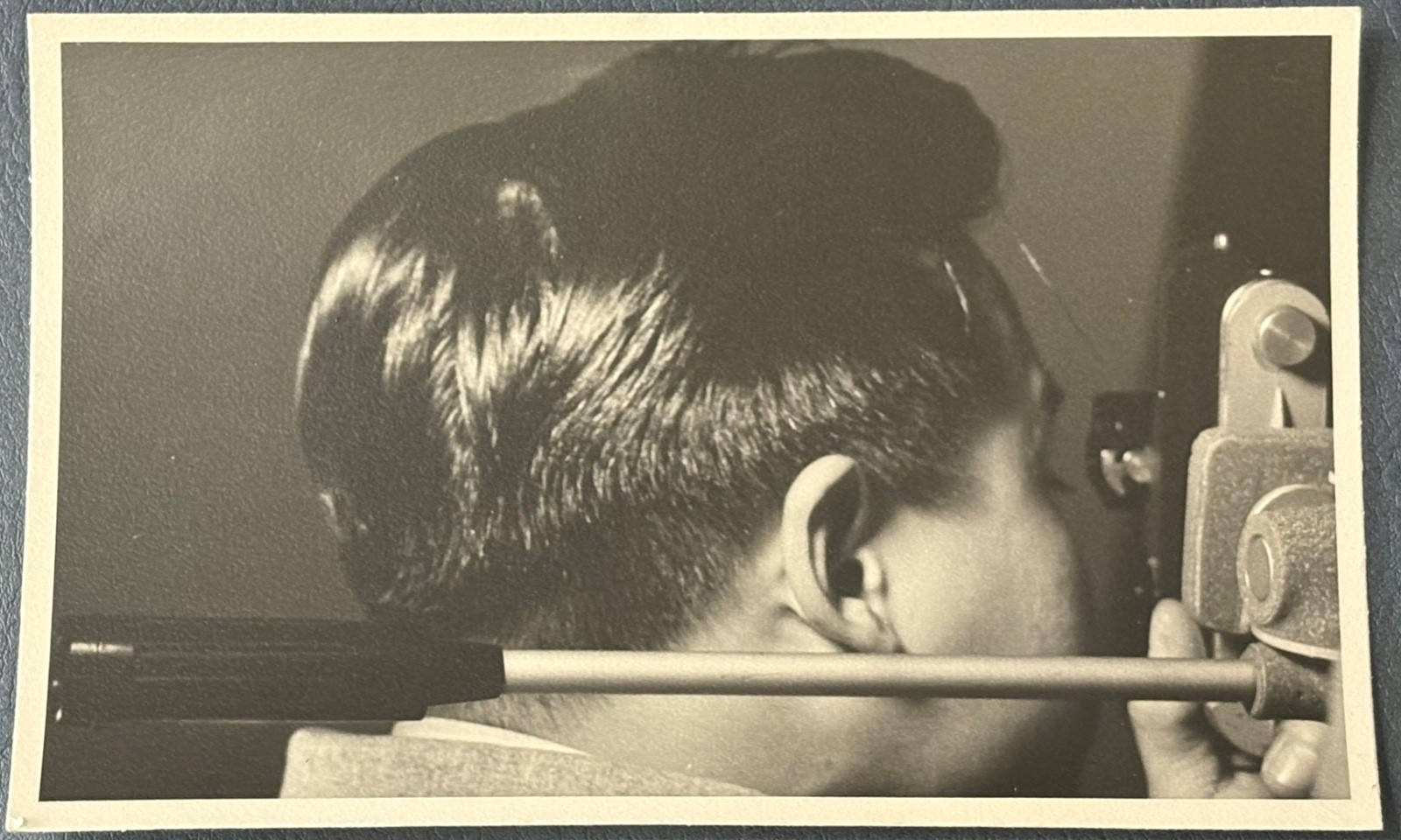 CLOSE UP PHOTO~MAN LOOKS IN LENS OF SURVEYING INSTRUMENT-SURVEYOR AT WORK 