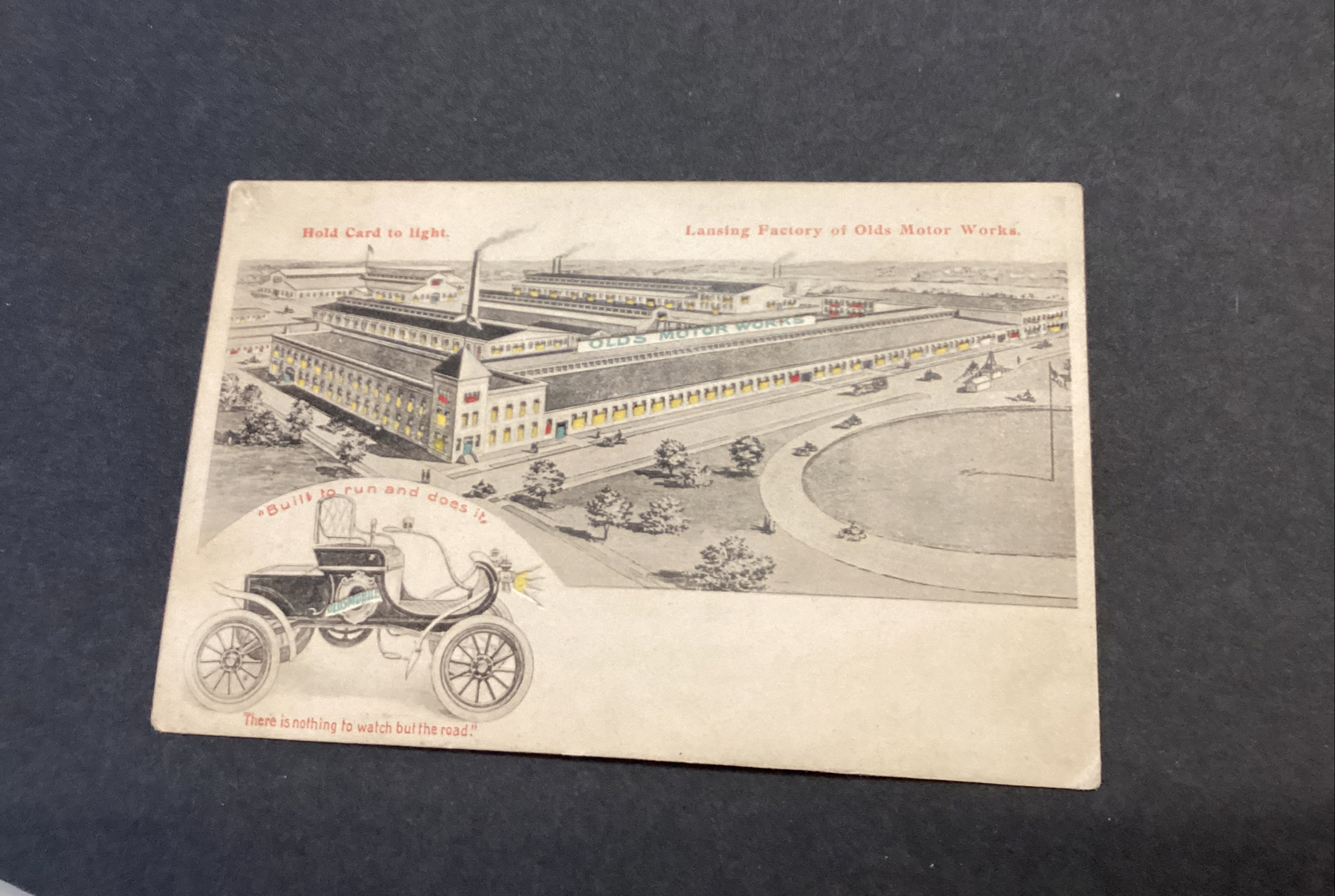 Oldsmobile Factory Lansing MI HOLD TO LIGHT POSTCARD Olds Motor Works Car Auto