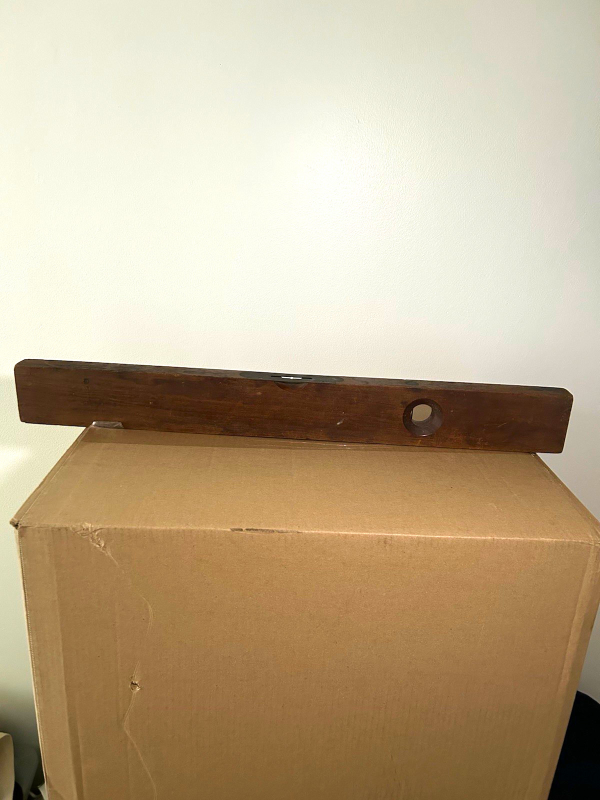 Antique Stanley No. 0 wooden level (1890 patent); both spirit vials are intact.