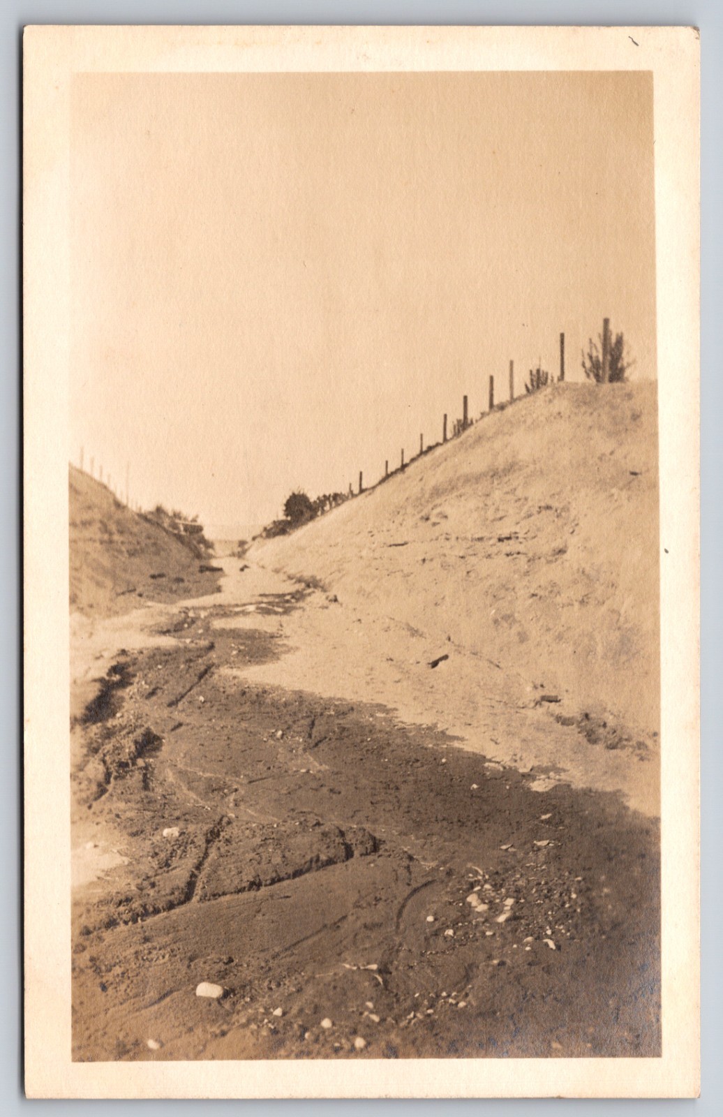 Dirt Road Tracks Running Through Deep Earthen Cut With Fence On Ridge Scene RPPC