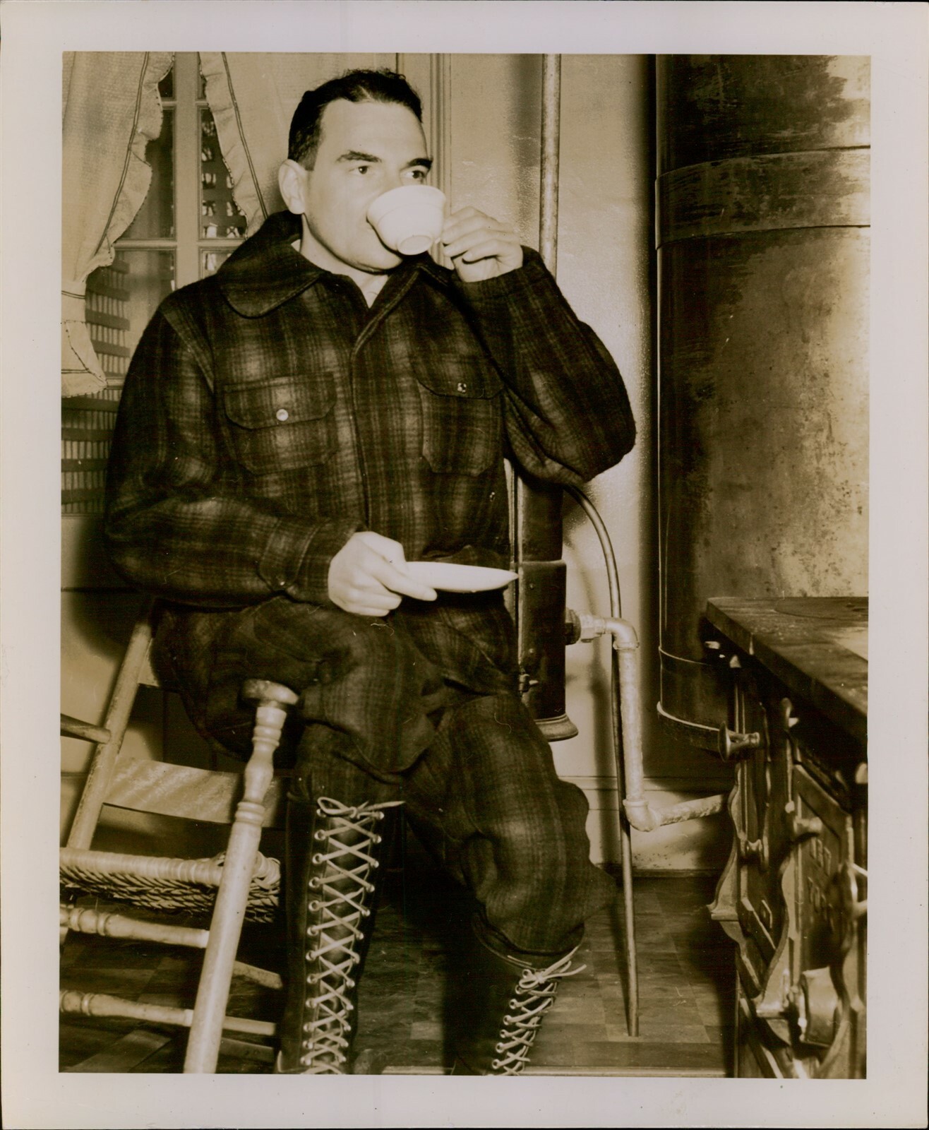GA38 Original Photo KENDALL BELLAMORE Rugged Man in Cabin Drinks Tea by Stove