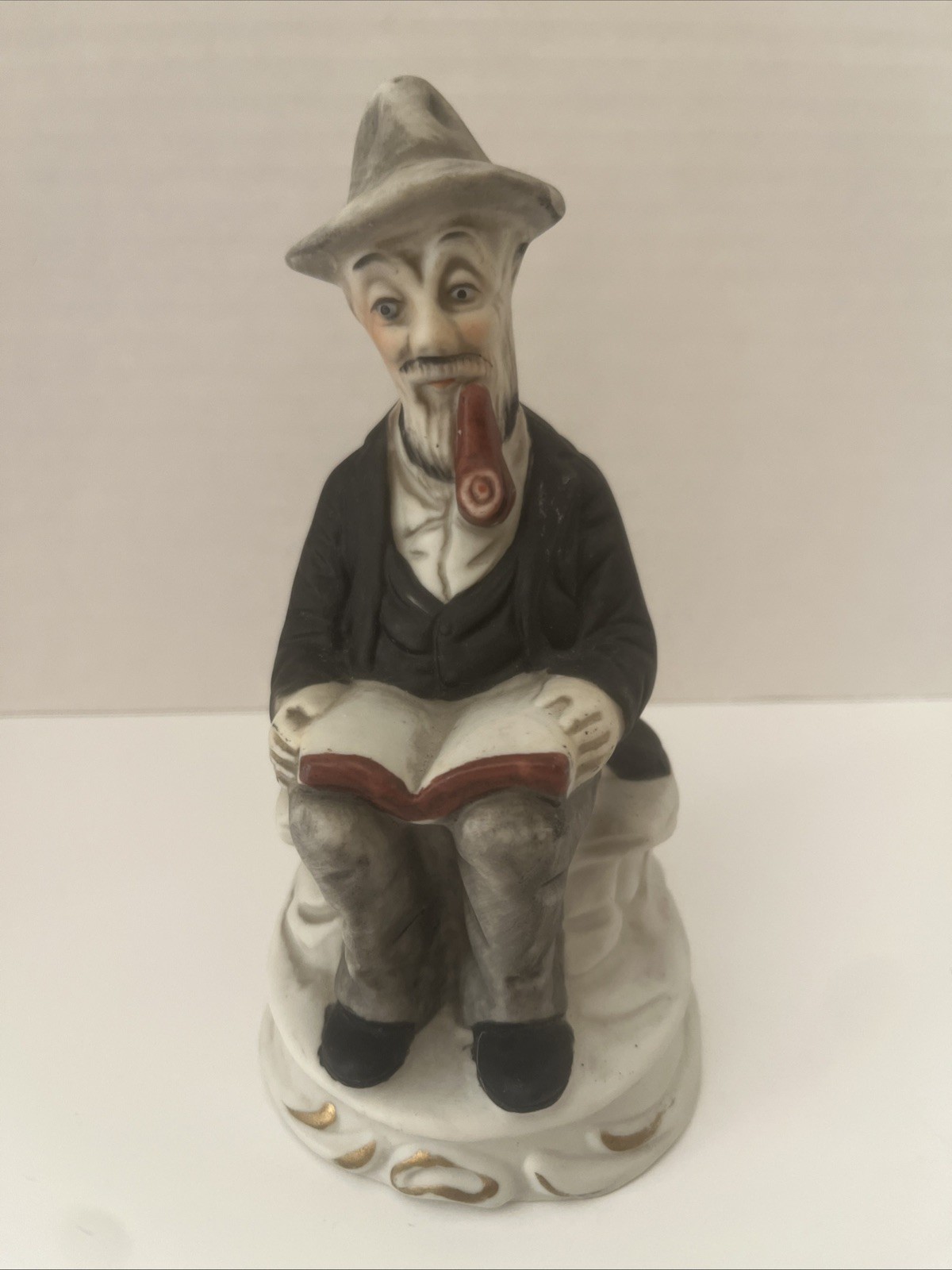 Vintage Deville Old Man Sitting On Bench Smoking Pipe And Reading