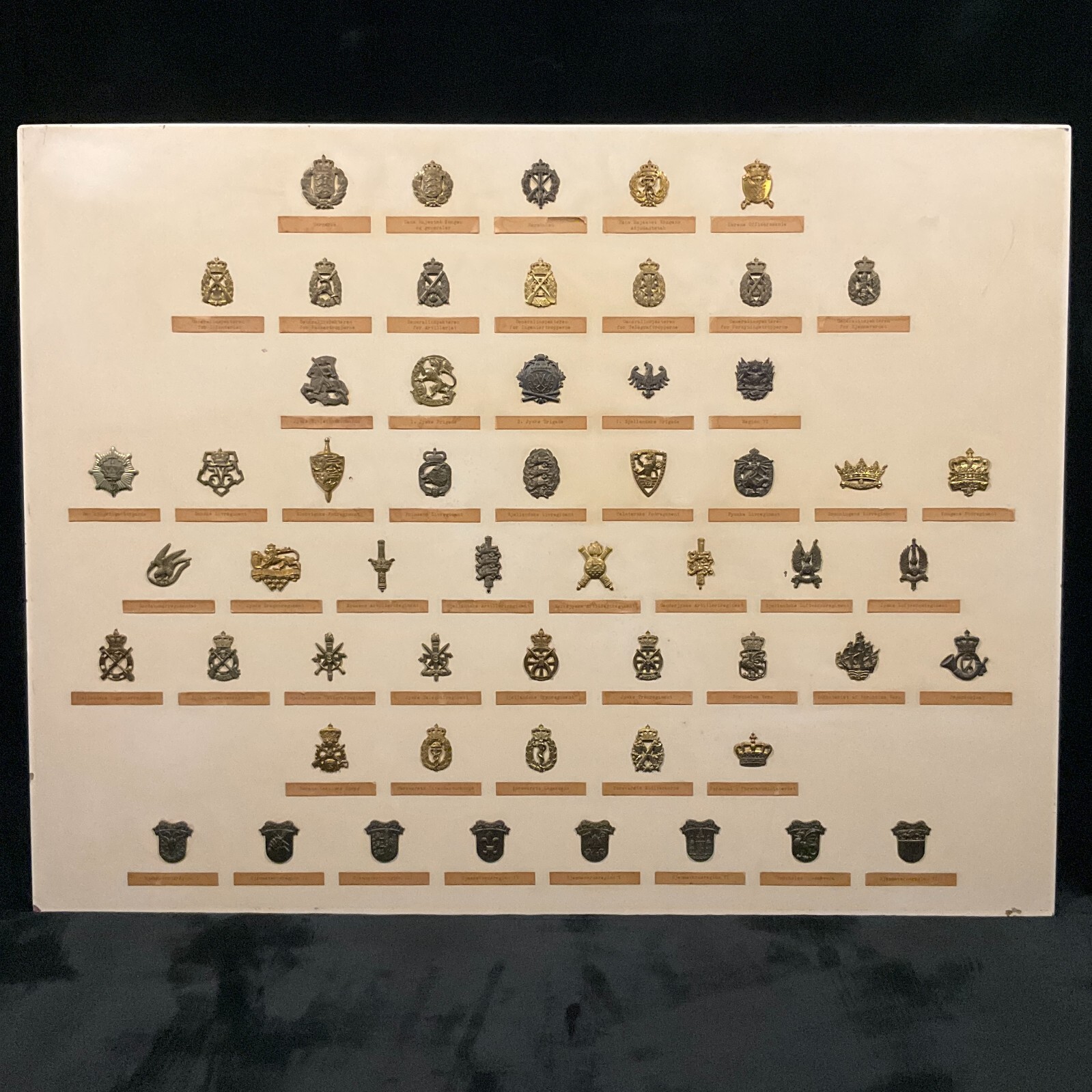 Collection of 56 Antique WWI & WWII Royal Danish Military Badges on the Board