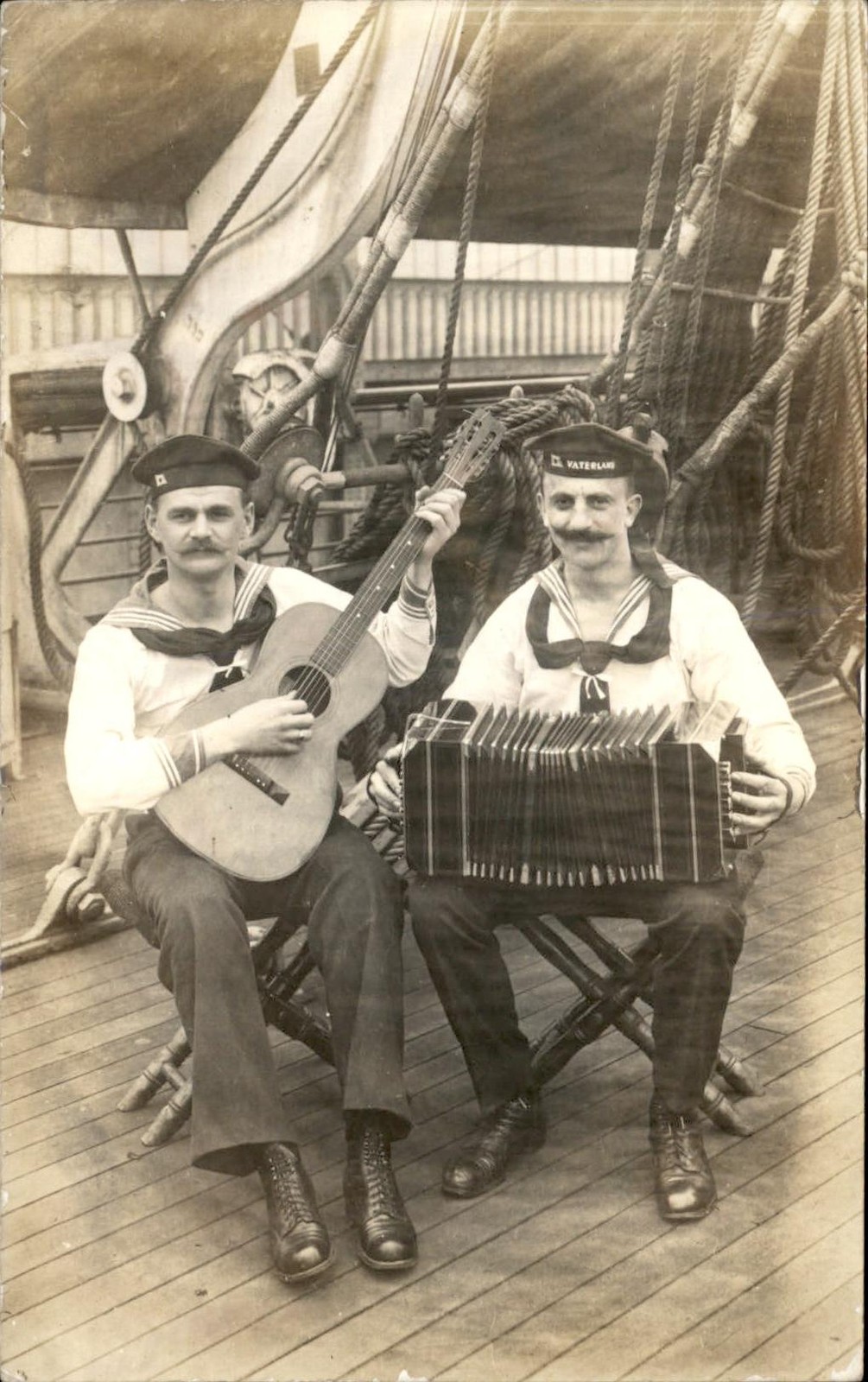 Sailors with guitar and accordion VATERLAND CAP c1910s Real Photo Postcard bhn