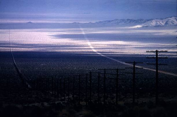 Between Los Angeles Las Vegas telegraph poles run parallel a highw- Old Photo