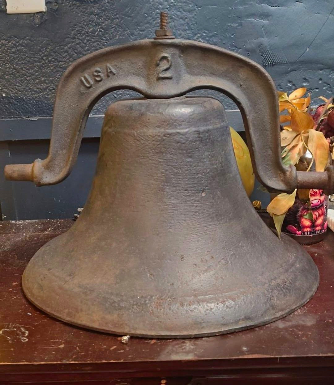 Antique No. 2 Cast Iron Farm Bell complete with its original top yoke mount.
