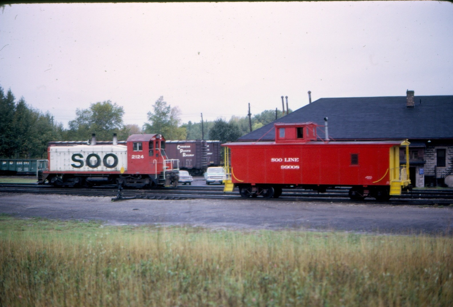 Soo Line SW12 #2124 & caboose #990081 @ Sault Ste. Marie MI- 1994 Kodak slide