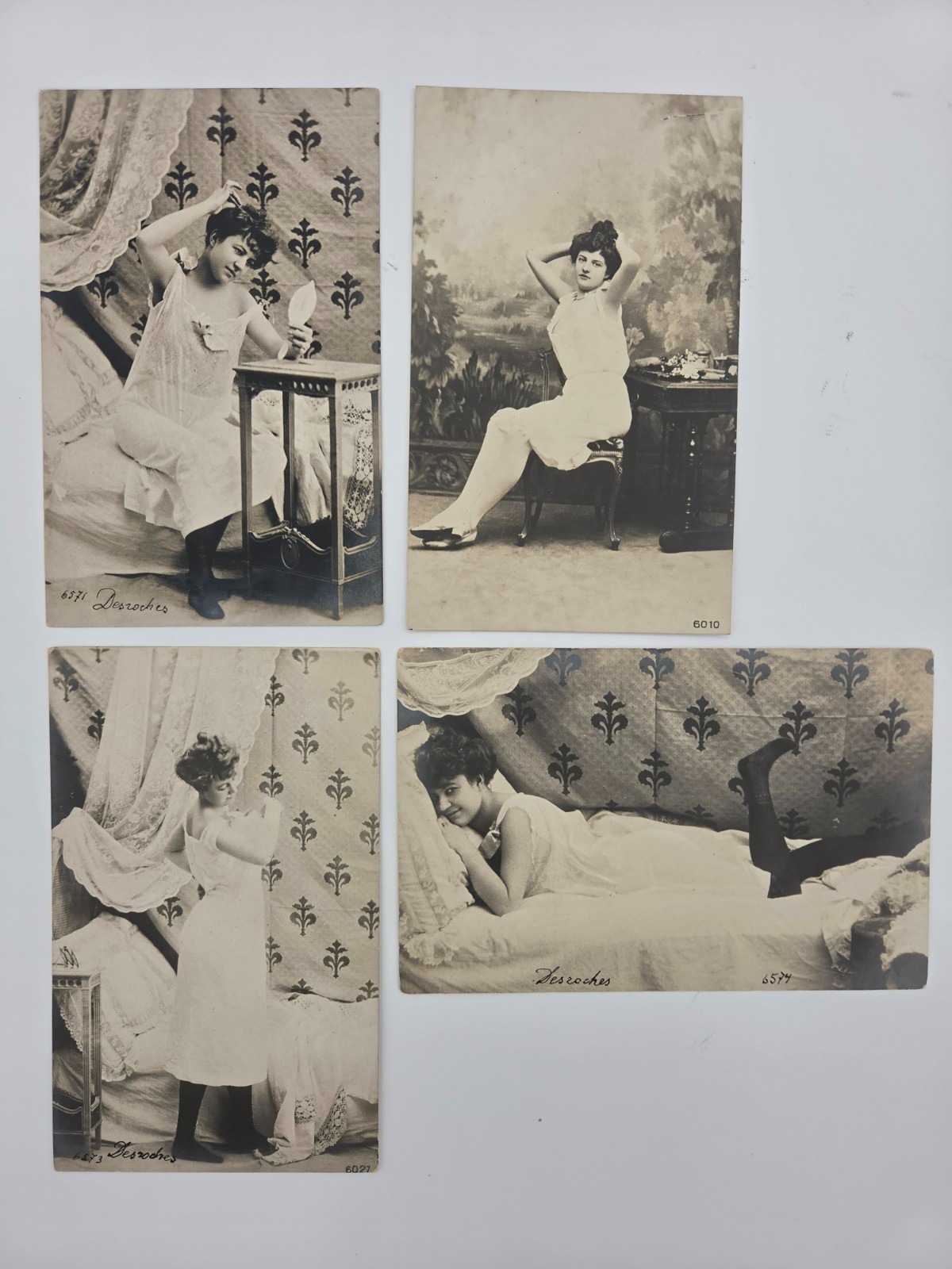 Four elegant antique postcards featuring a young lady.   1900 Tsarist Russia