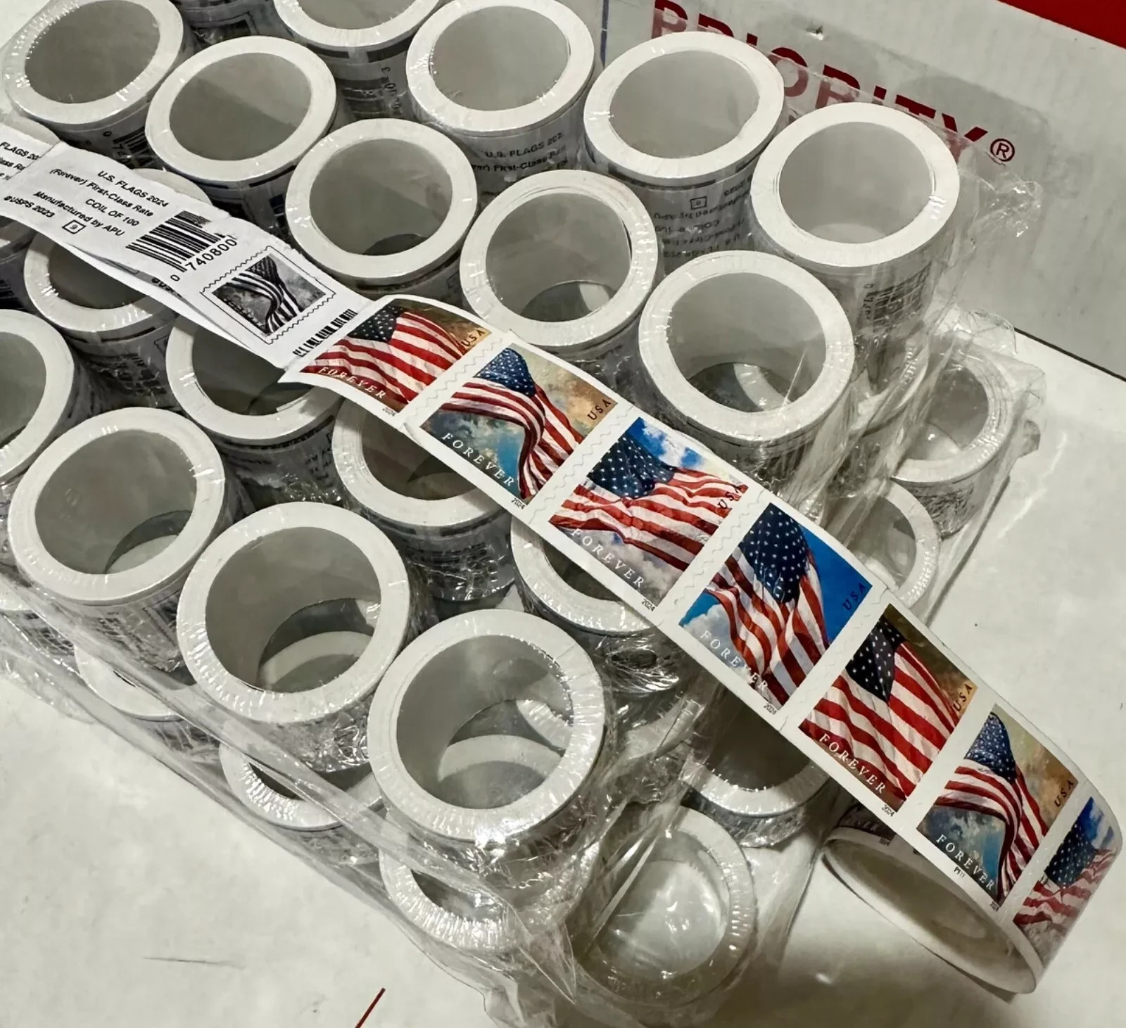 5 rolls of 100 USPS postage stamps, totaling 500 pieces