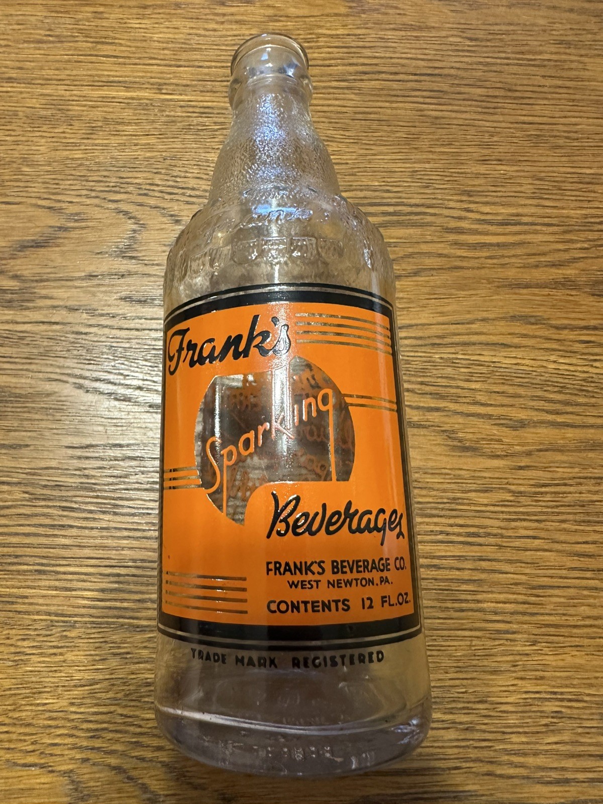 WEST NEWTON,PA FRANK'S BEVERAGES SCARCE EARLY ORANGE & BLACK ACL SODA BOTTLE