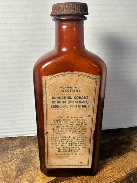 * Antique Buckley\'s Canadiol Mixture Medicine Bottle Amber Medicine Bottle