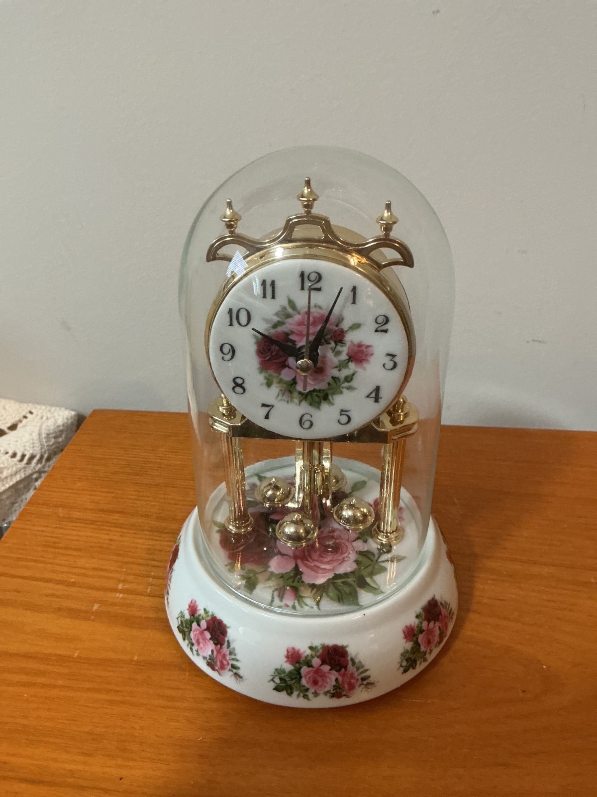 This is a vintage anniversary clock featuring the Royal Albert Old Country