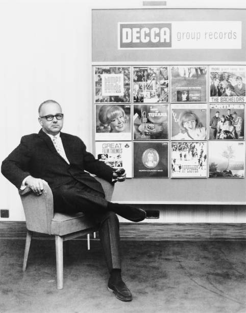 Decca Records producer A&R man Dick Rowe 1965 Behind him is a disp- Old Photo