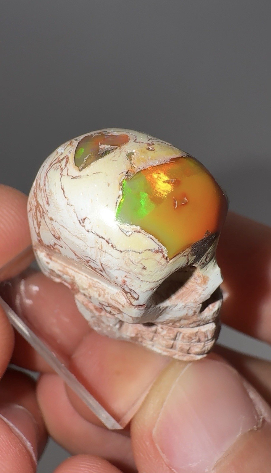 Hand Carved Mexican Cantera Fire Opal Skull 11.18g 30x20mm Electric Green Flash⁠