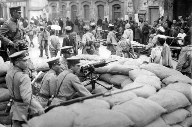 Beiyang government troops leaving Jinan walk front a barricade - Japan Old Photo