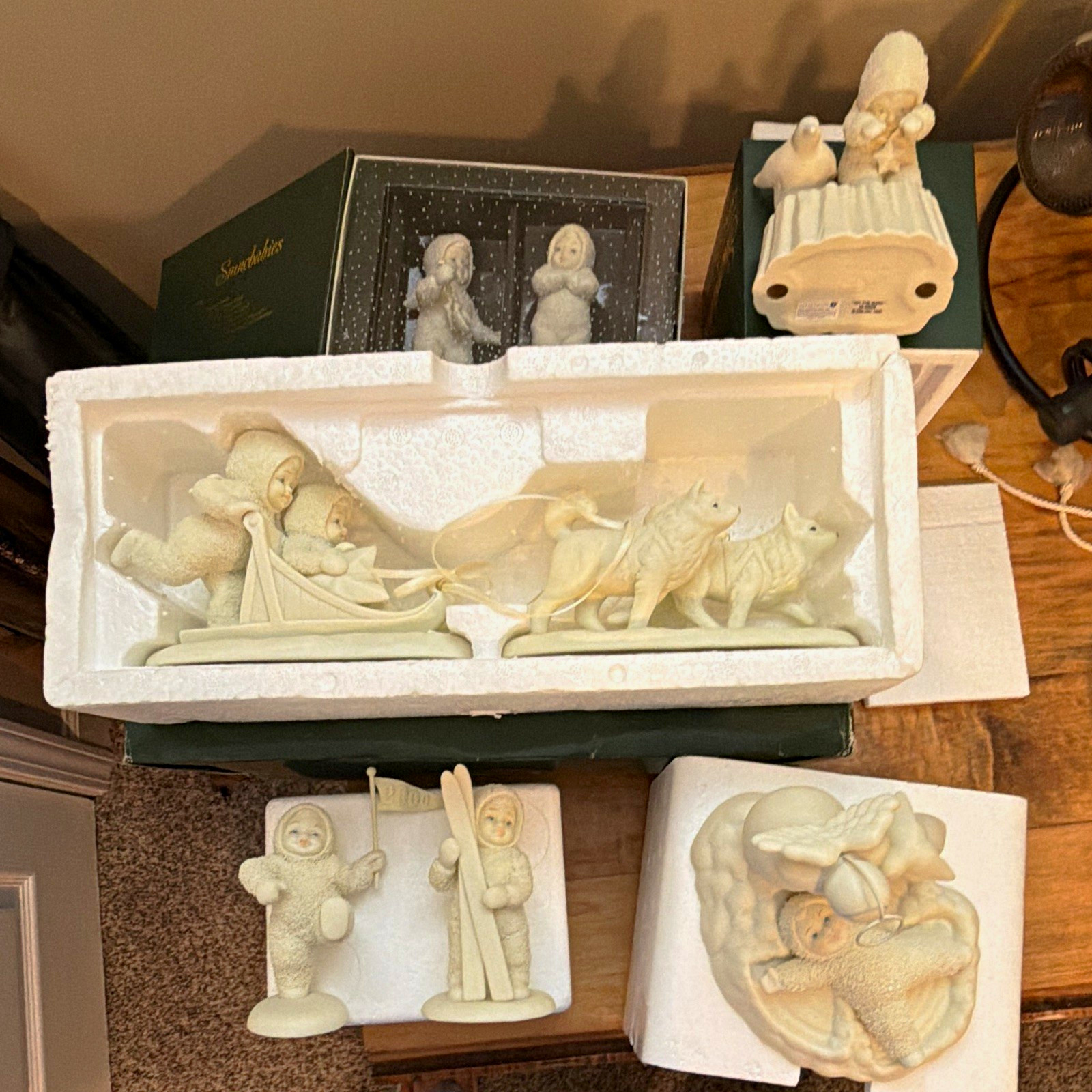 Snow babies , only set out on a table at Christmas time, then reboxed and stored