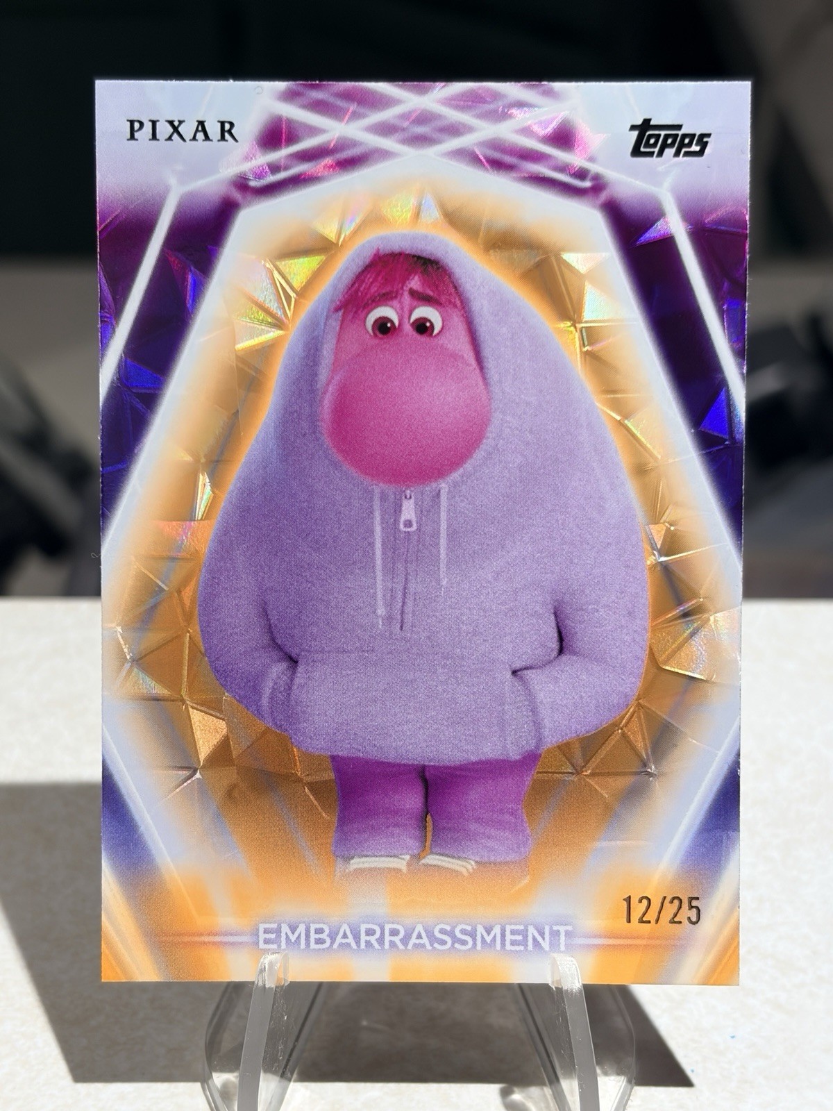 2026 Topps Disney Neon Embarrassment Orange Diamante #/25 (12/25) Inside Out 2