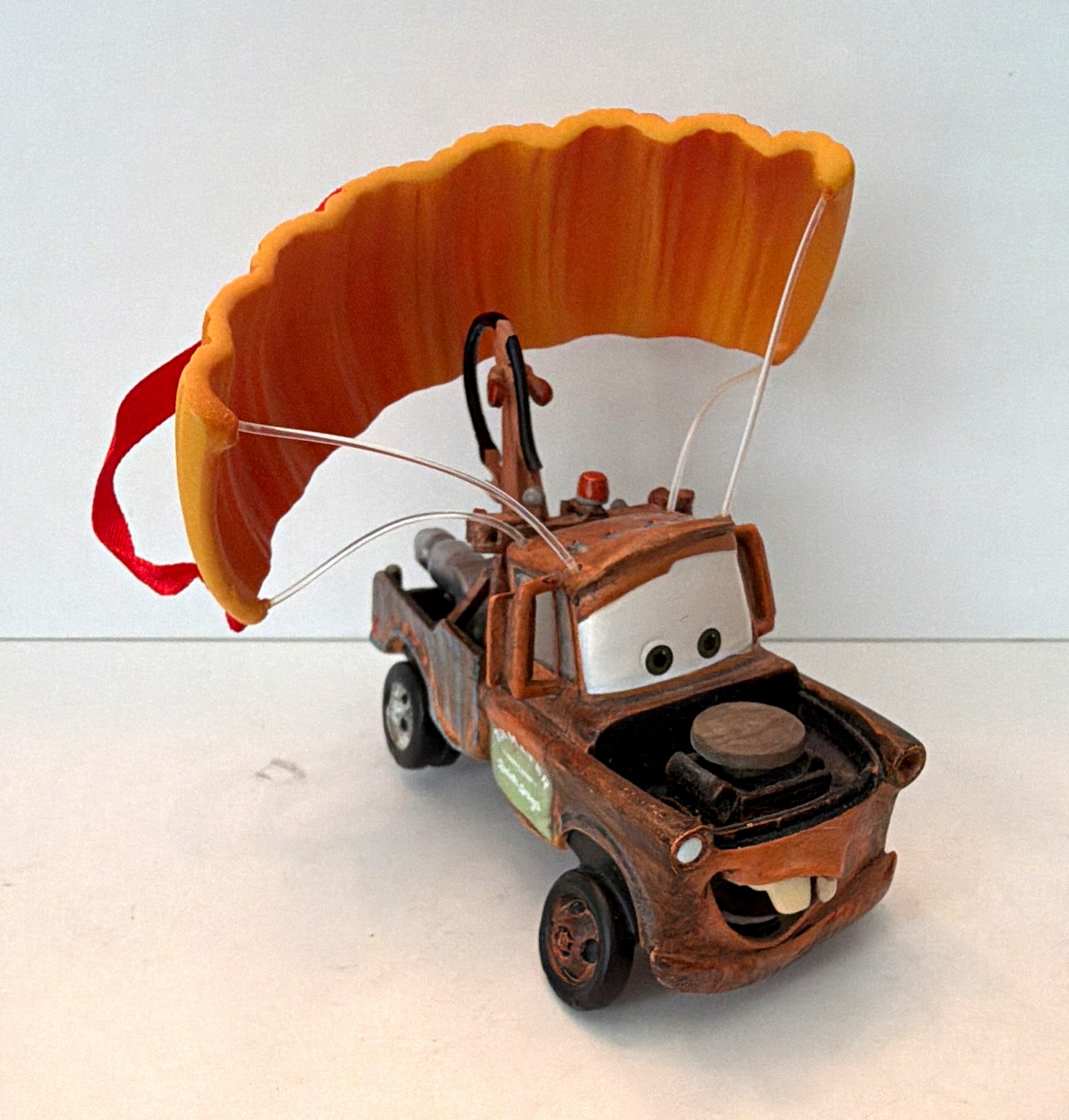 Disney/Pixar Cars Tow Mater Holiday Ornament w/ Ribbon Parachute