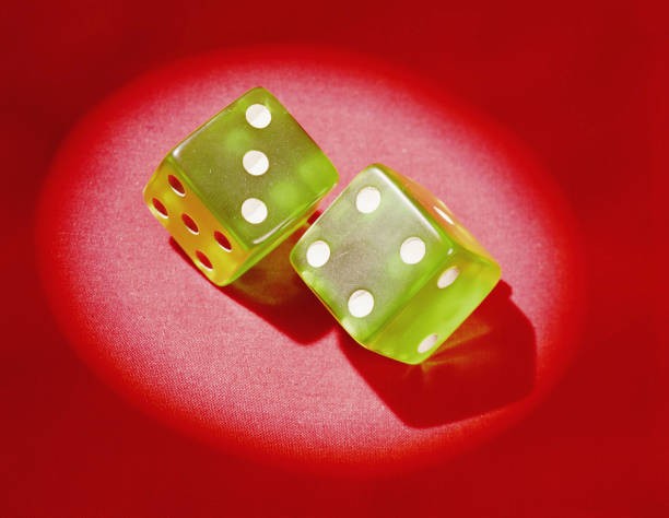 1960s Pair of green plastic dice showing lucky 7' Historic Old Photo