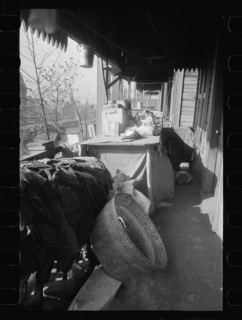 Photo:1930s Porch Table Buckets House Exterior Covered Walkway Carl Mydans