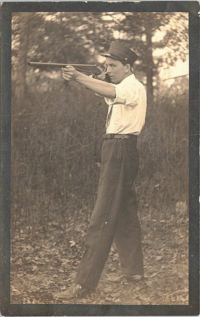 RPPC Teenaged Boy Shooting Toy Rifle or Shotgun early 1900s