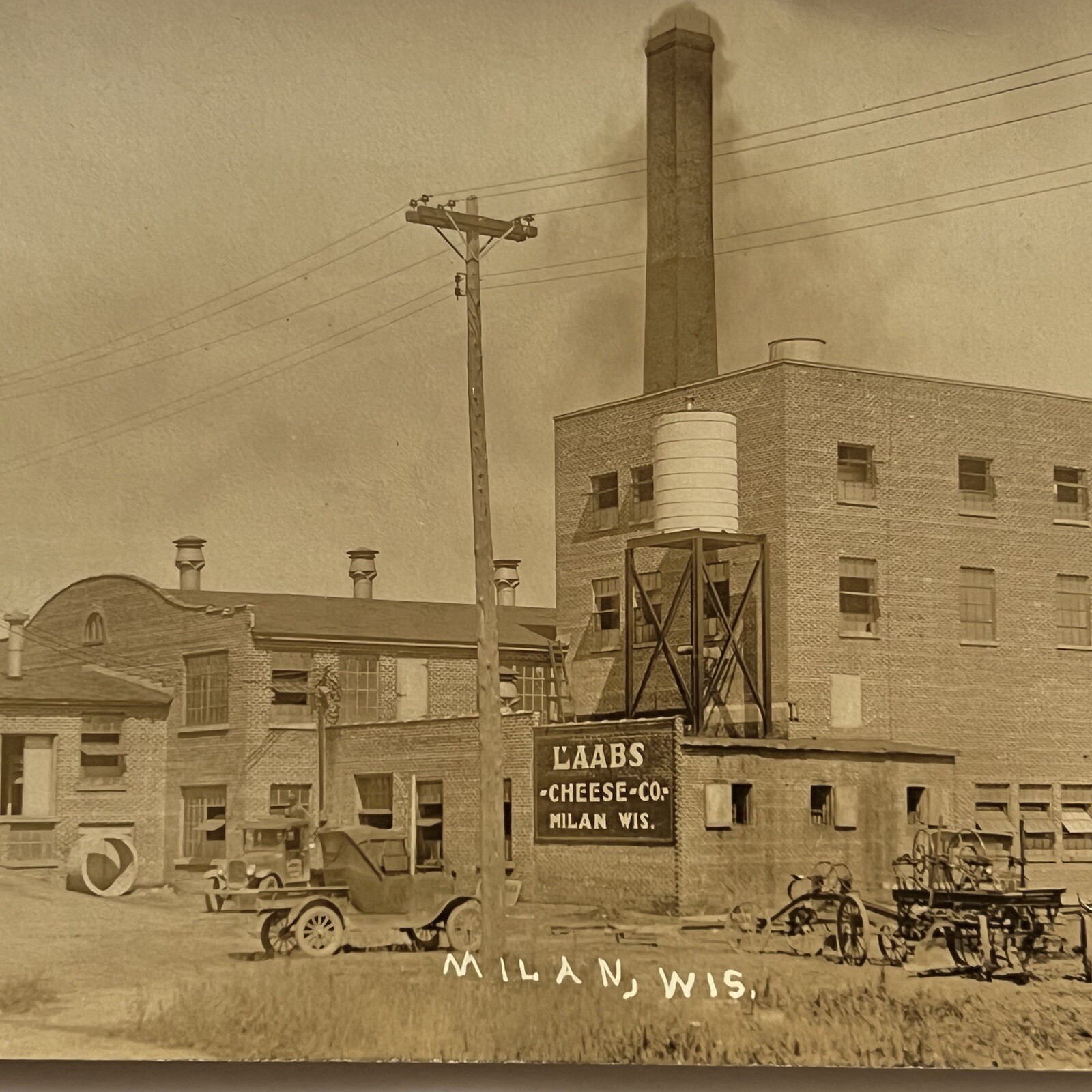 Antique RPPC Real Photograph Postcard Street Odd Laabs Cheese Factory Milan WI