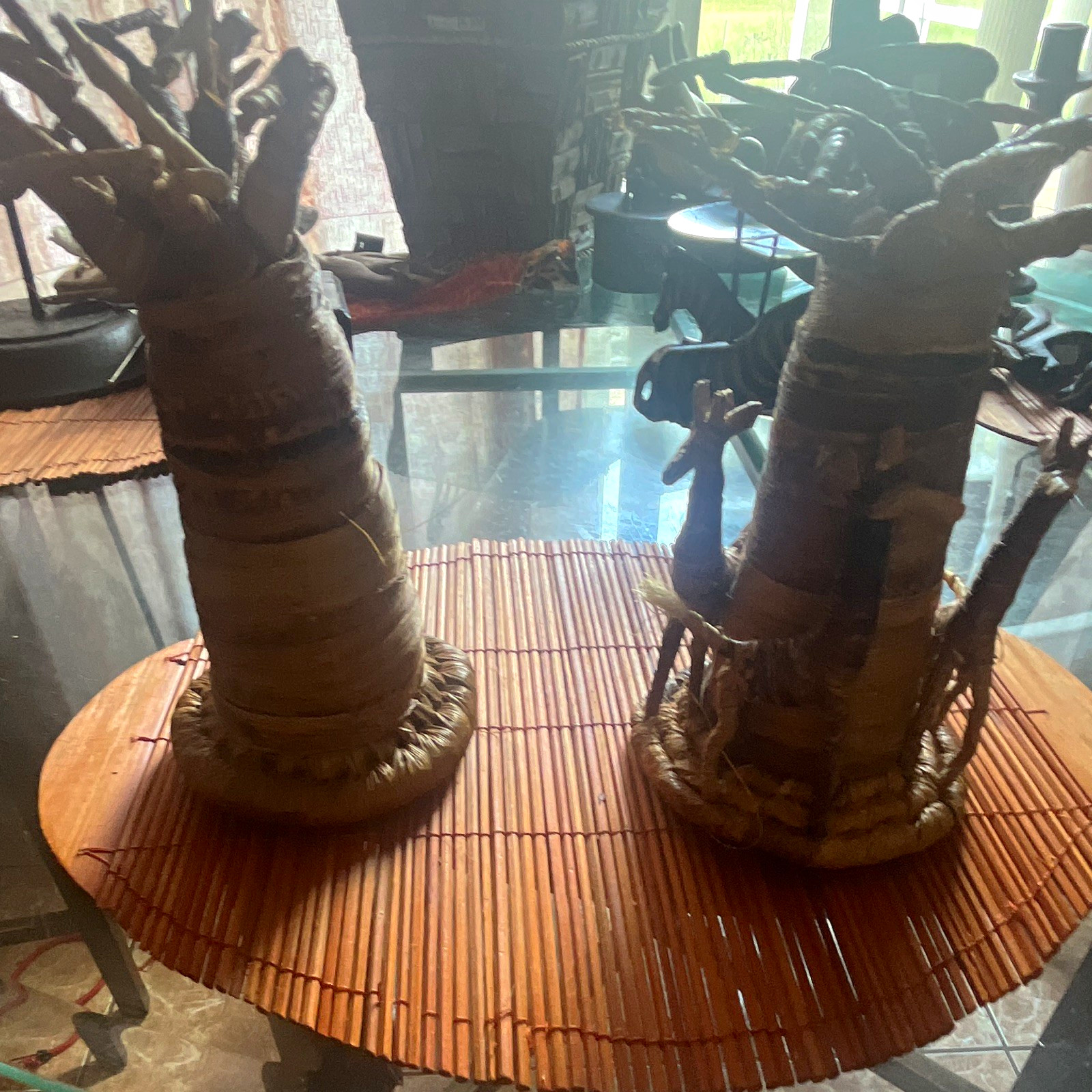 Pair of African Handmade Figurine Sculptures on Woven Bases - 2 Piece