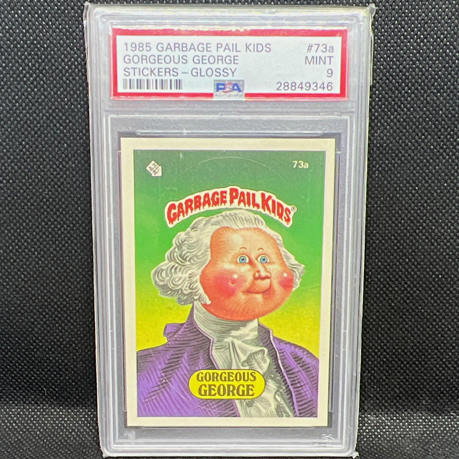 1985 Topps Garbage Pail Kids Gorgeous George #73a, Glossy Sticker, PSA 9