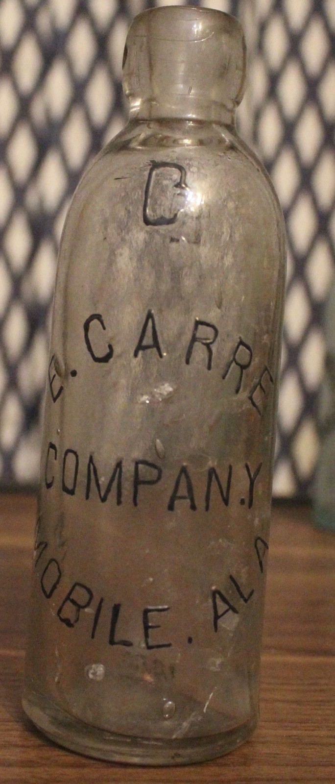E. Carre Company Mobile Alabama Embossed Clear Hutchinson Bottle