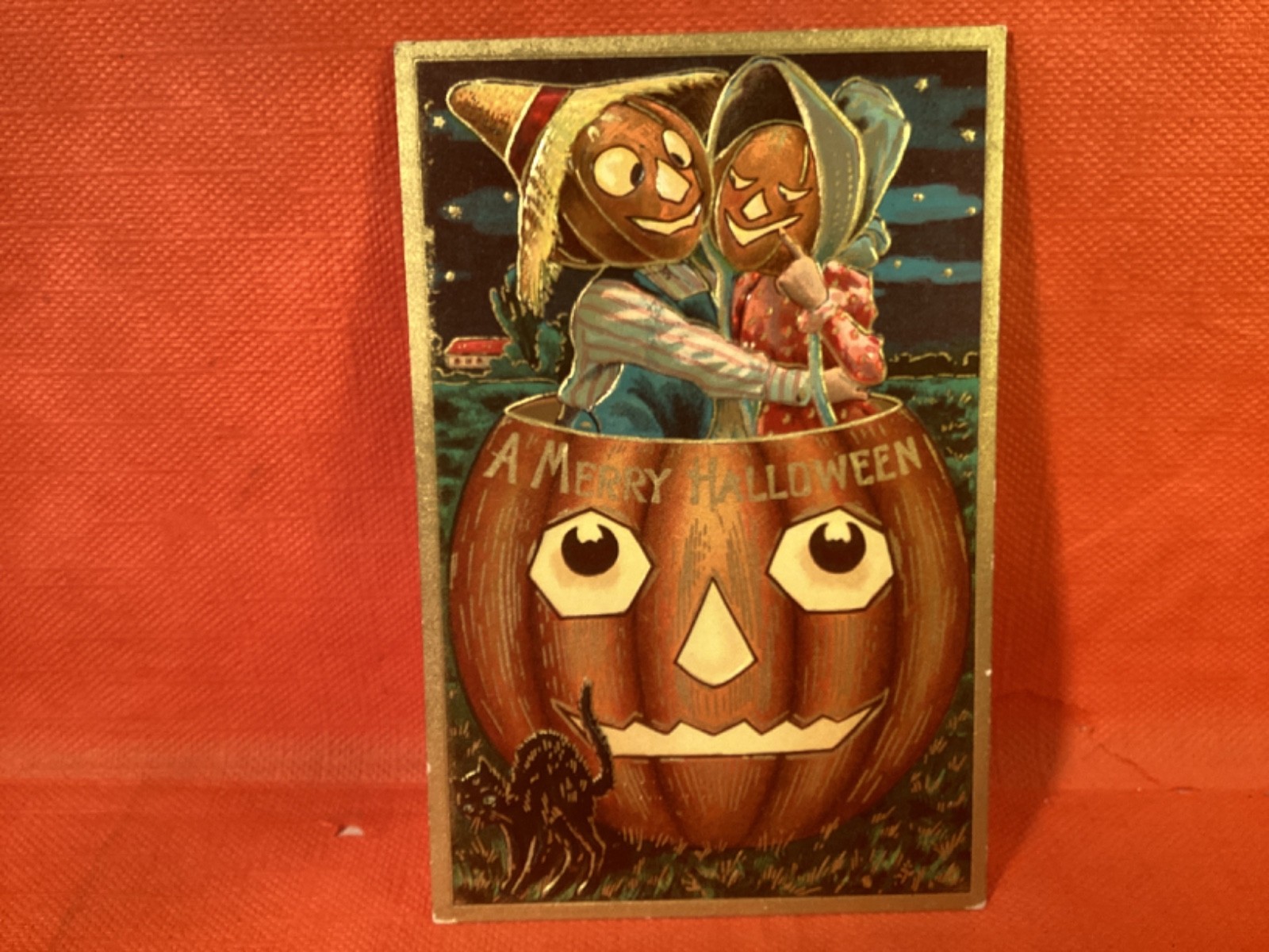 VINTAGE HALLOWEEN EARLY EMBOSSED POST CARD NOT POSTED JOL COUPLE IN HEAD OF JOL