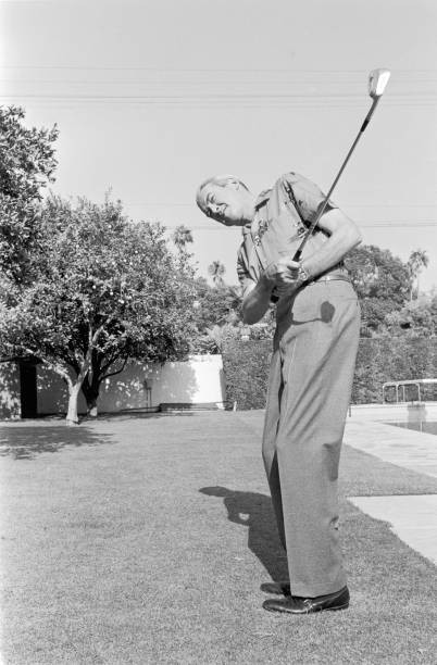 Full length image American actor James Stewart swinging a golf clu- Old Photo